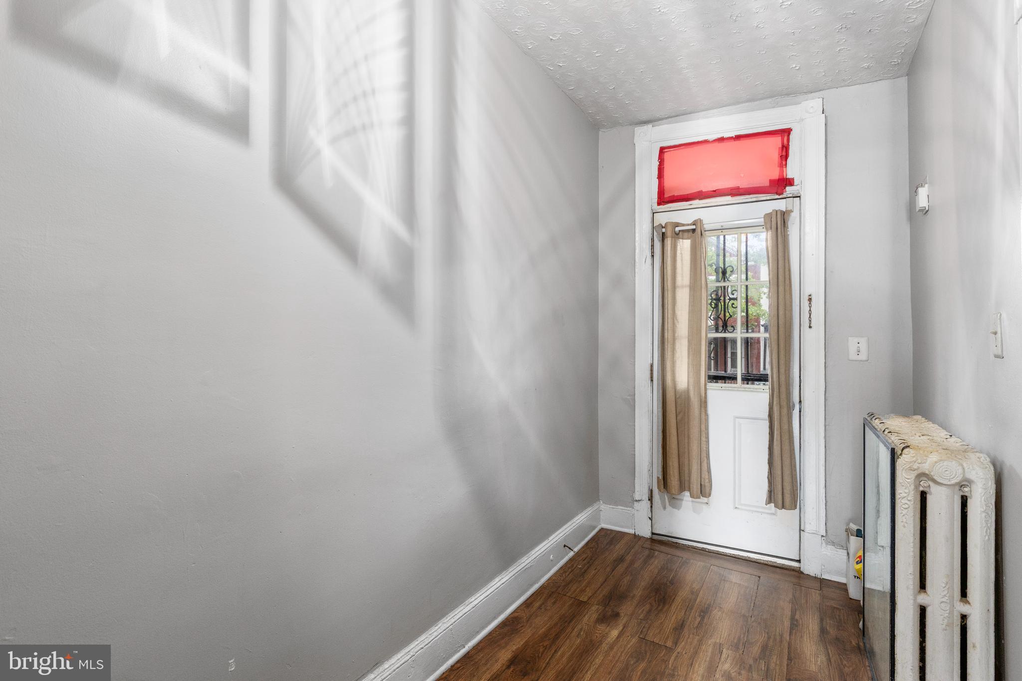 619 Columbia Road Northwest Washington, DC 20001 - Photo 7 of 29 a view of a hallway with wooden floor and closet