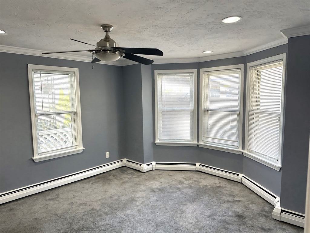396 Durfee Street, Unit 1 Fall River, MA 02720 - Photo 1 of 13 a view of an empty room with a window