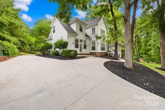 a view of a house with a street