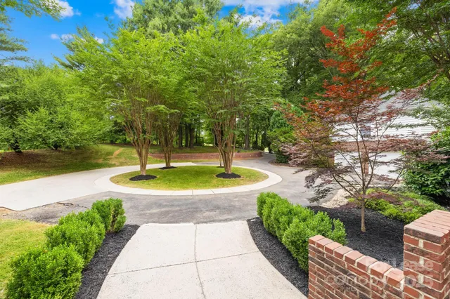 a view of a fountain with a yard