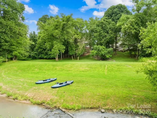 a view of a lake with a yard