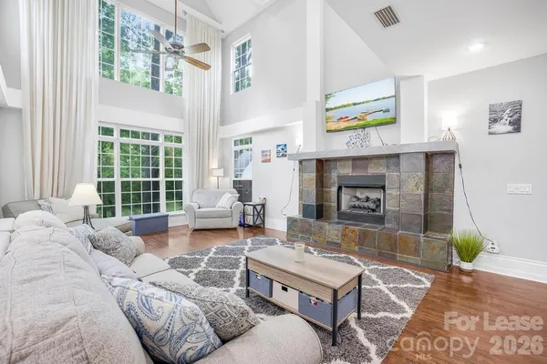 a living room with furniture and a fireplace