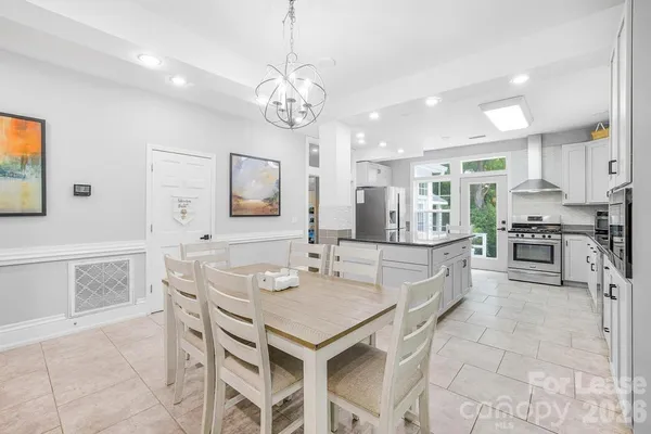 a kitchen with stainless steel appliances granite countertop counter space and a refrigerator