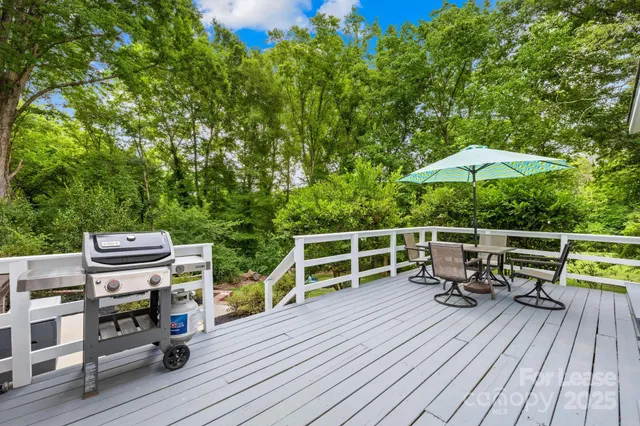 a view of roof deck with furniture and barbeque oven