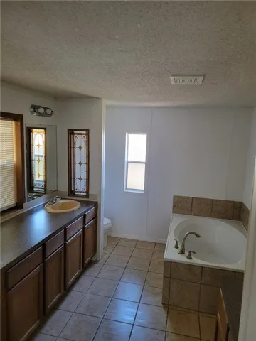 a bathroom with a sink and tub