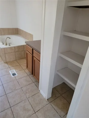 a utility room with cabinets