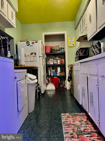 a utility room with furniture a washer and dryer