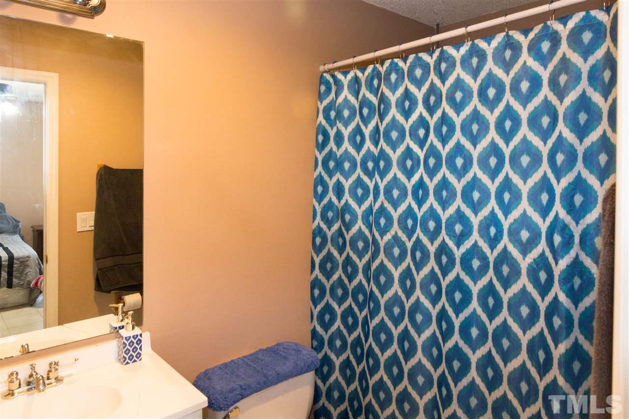 3613 Croydon Mill Way Raleigh, NC 27616 - Photo 12 of 19 a bathroom with a sink and a mirror