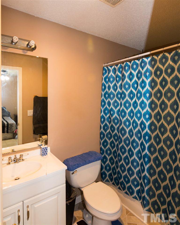 3613 Croydon Mill Way Raleigh, NC 27616 - Photo 13 of 19 a bathroom with a sink and a mirror