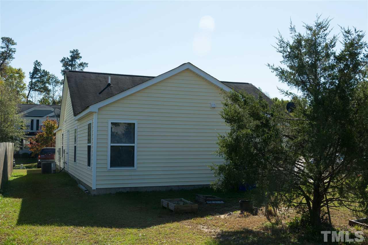 3613 Croydon Mill Way Raleigh, NC 27616 - Photo 18 of 19 a view of a house with a yard