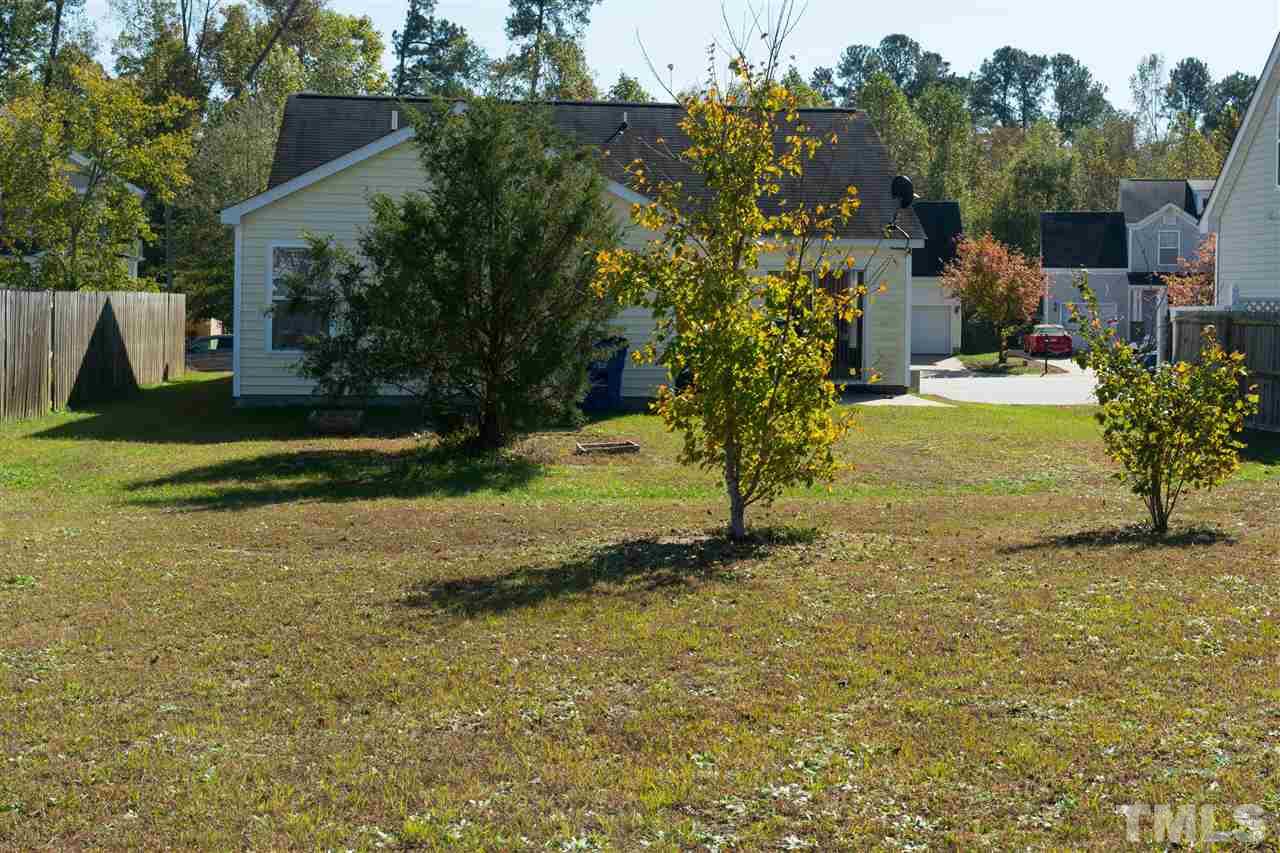 3613 Croydon Mill Way Raleigh, NC 27616 - Photo 19 of 19 a view of a yard in front of a house with a large tree