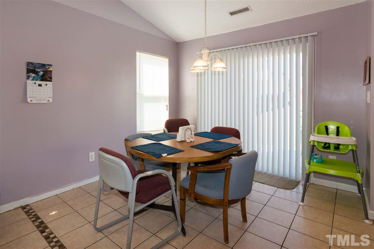 3613 Croydon Mill Way Raleigh, NC 27616 - Photo 7 of 19 a view of a dining room with furniture and a carpet