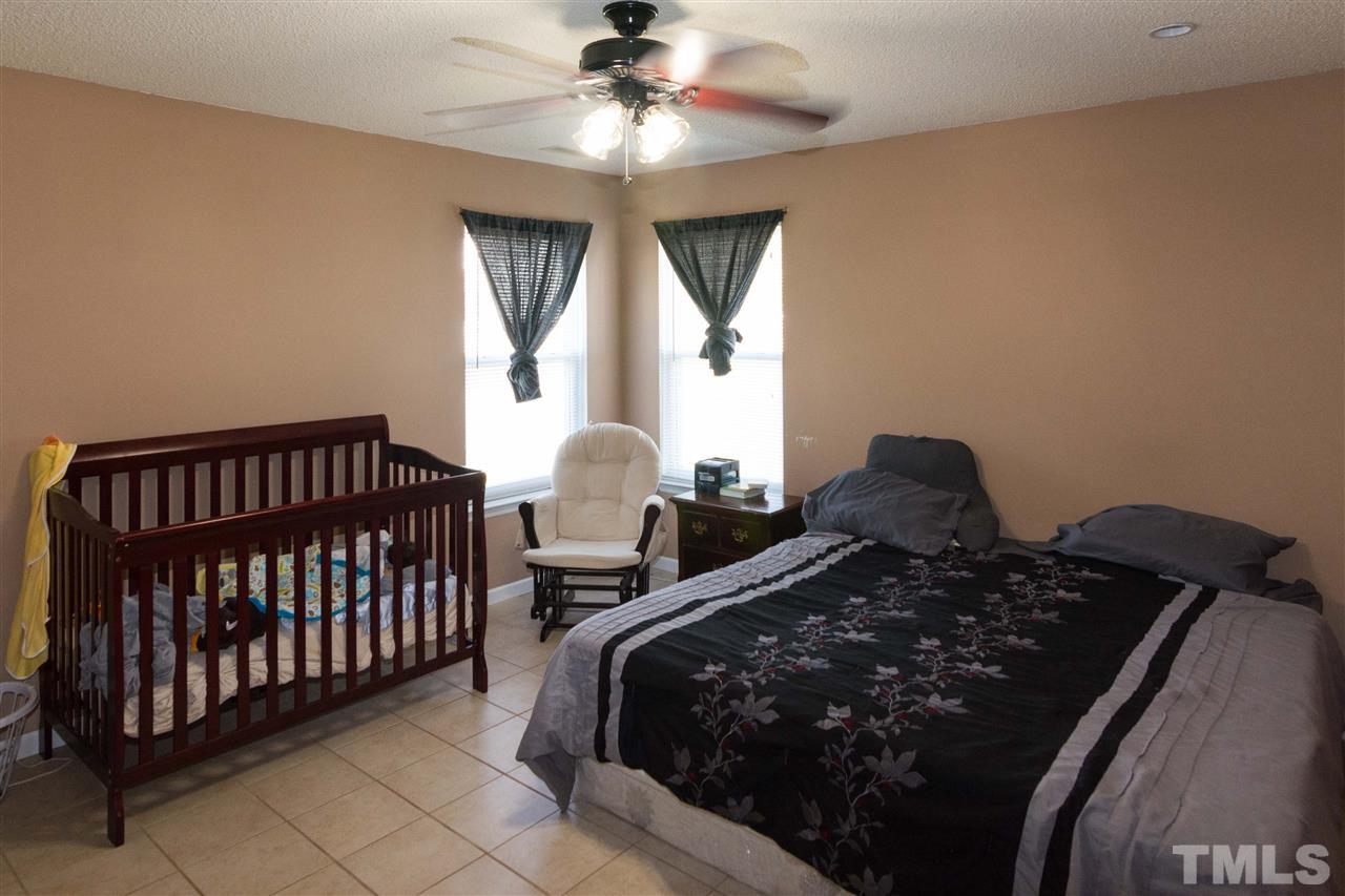 3613 Croydon Mill Way Raleigh, NC 27616 - Photo 10 of 19 a bedroom with a bed and window