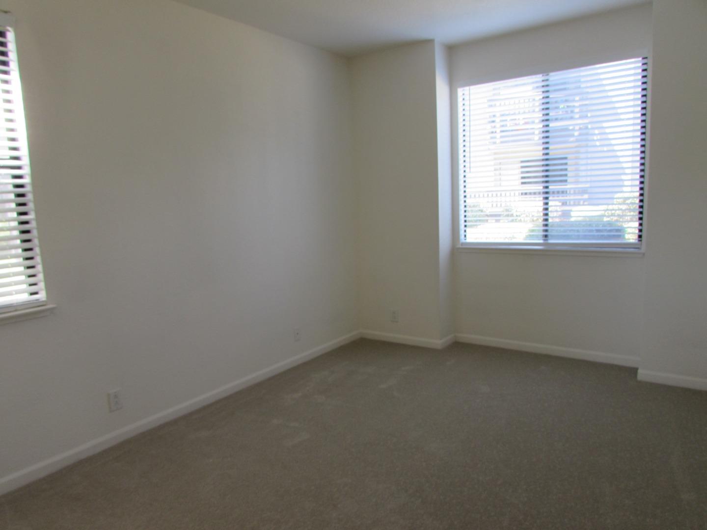 409 Tyler Place, Unit B Salinas, CA 93906 - Photo 13 of 25 an empty room with a window