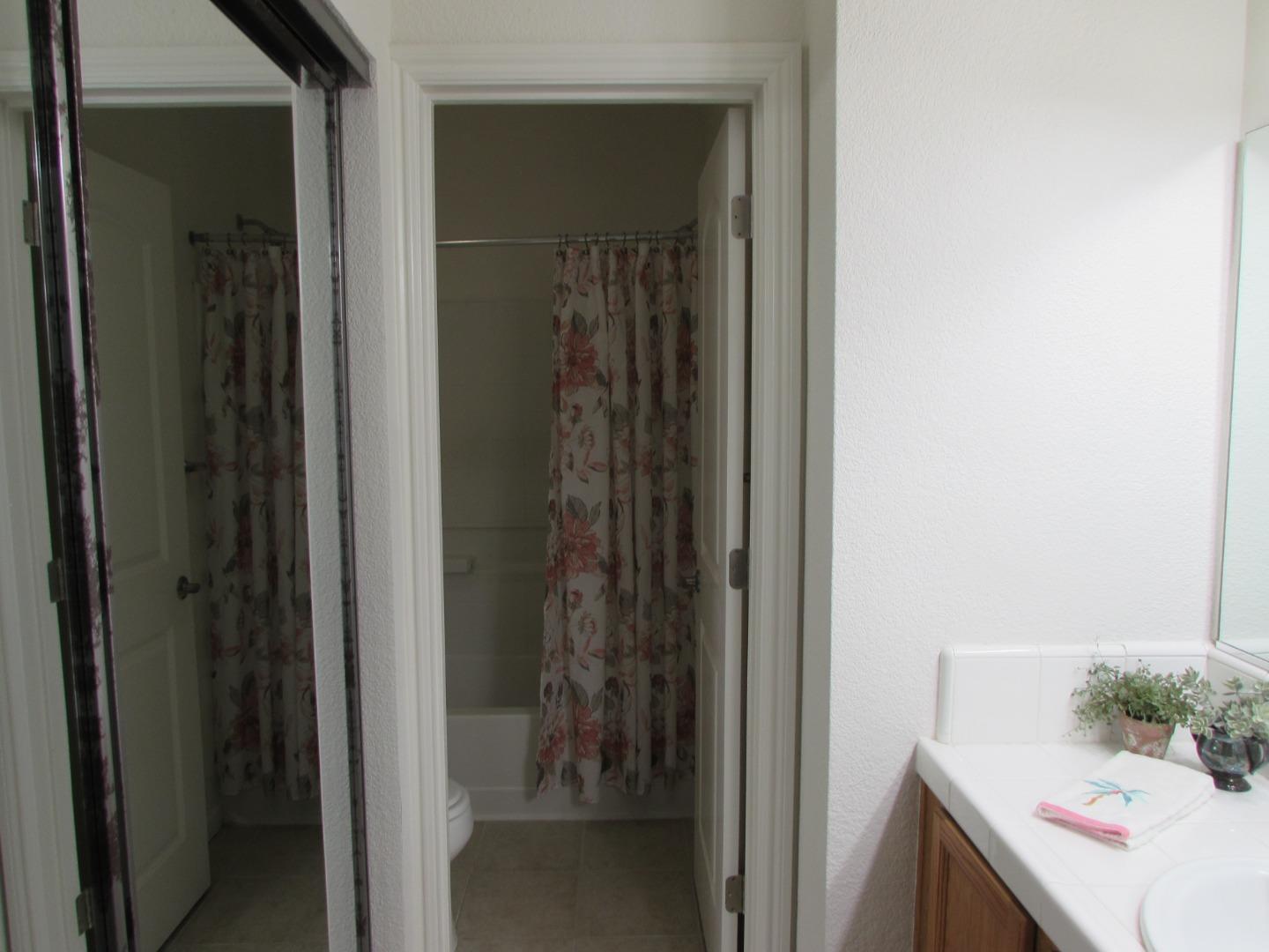 409 Tyler Place, Unit B Salinas, CA 93906 - Photo 16 of 25 a bathroom with a sink and a mirror