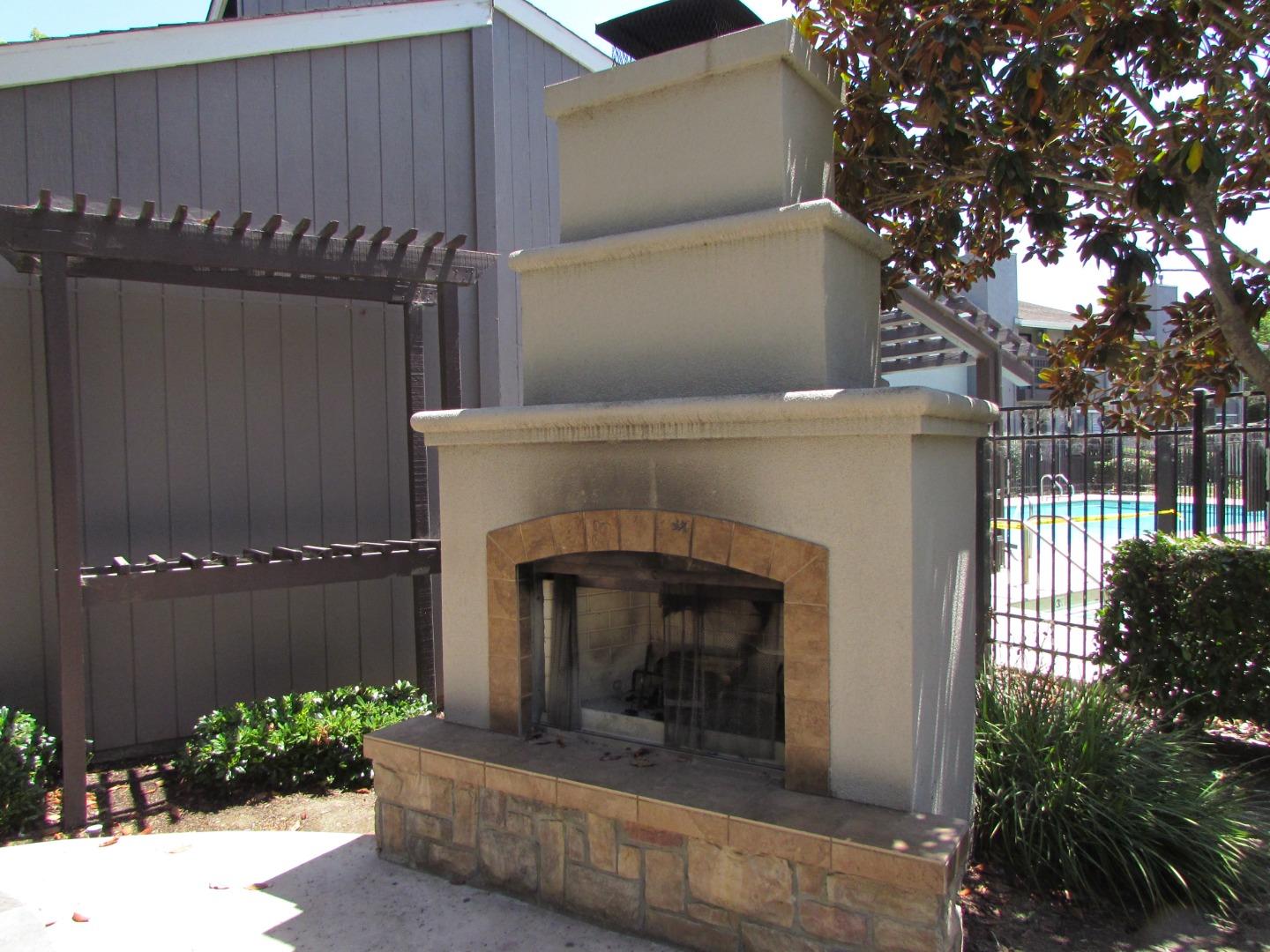 409 Tyler Place, Unit B Salinas, CA 93906 - Photo 23 of 25 a front view of a house with a garden