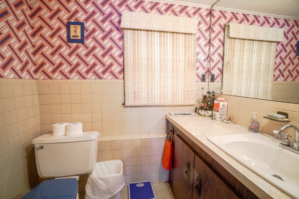 53 Yale Road Needham, MA 02494 - Photo 19 of 21 a bathroom with a sink and a mirror