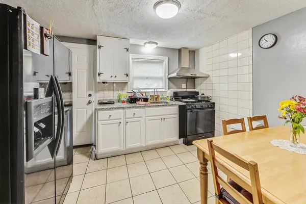 a kitchen with a sink appliances and cabinets