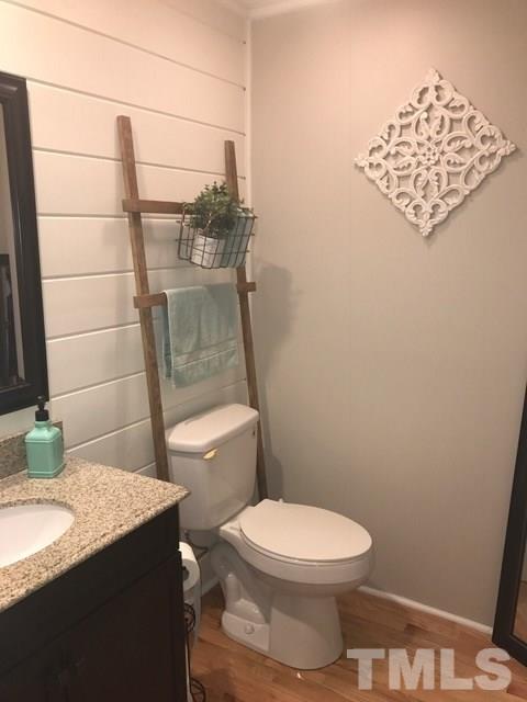 5349 Range Road Rougemont, NC 27572 - Photo 15 of 19 a bathroom with a granite countertop toilet and a sink