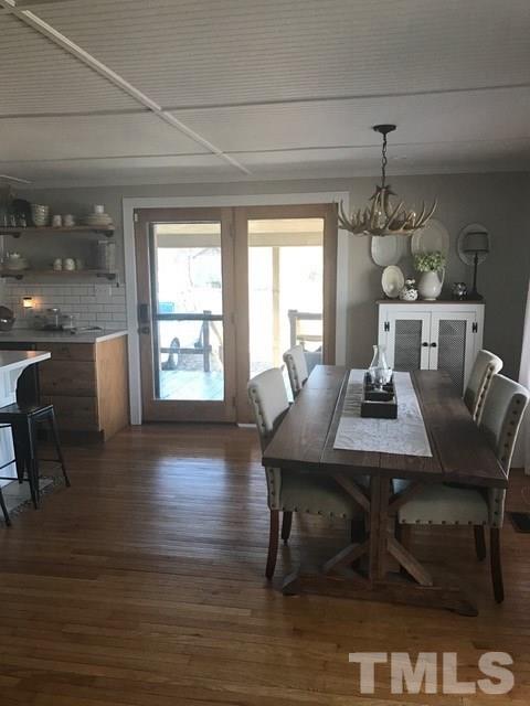 5349 Range Road Rougemont, NC 27572 - Photo 4 of 19 a view of a dining room with furniture window and wooden floor