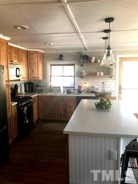 5349 Range Road Rougemont, NC 27572 - Photo 6 of 19 a kitchen with a sink stainless steel appliances and cabinets