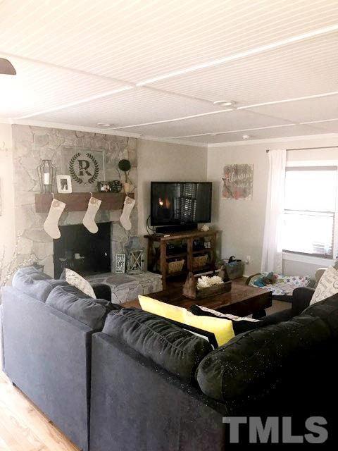 5349 Range Road Rougemont, NC 27572 - Photo 7 of 19 a living room with furniture and a flat screen tv