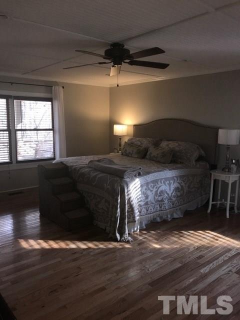 5349 Range Road Rougemont, NC 27572 - Photo 10 of 19 a bedroom with a bed and wooden floor