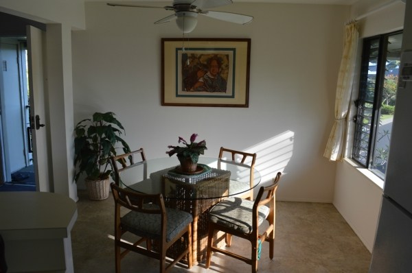 3830 Edward Road, Unit 11H Princeville, HI 96722 - Photo 12 of 14 a view of a dining room with furniture and window