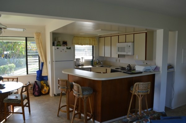 3830 Edward Road, Unit 11H Princeville, HI 96722 - Photo 10 of 14 a kitchen with sink cabinets and window