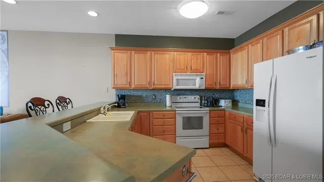 $450,000 | 1230 Lands End Parkway, Unit 304, Osage Beach, MO 65065