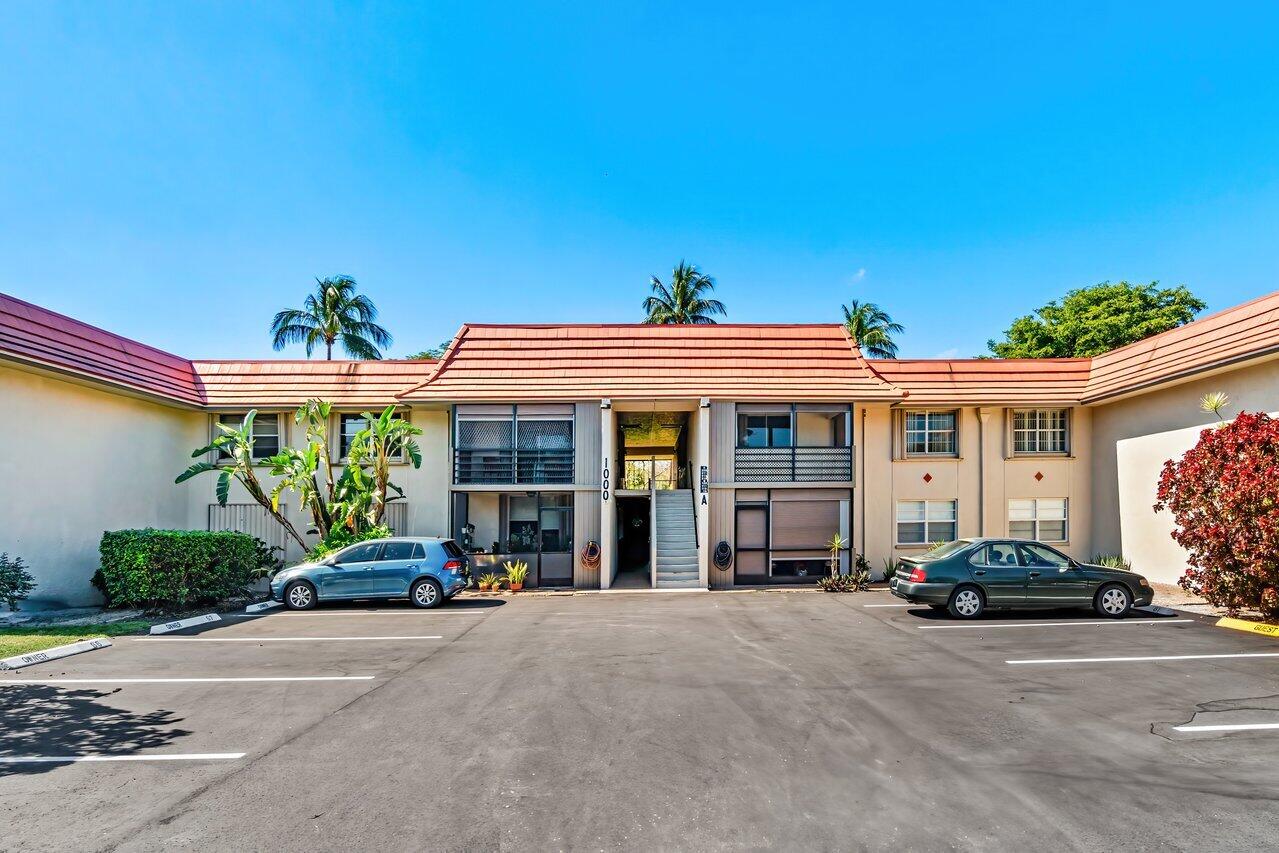 a view of a car park in front of house
