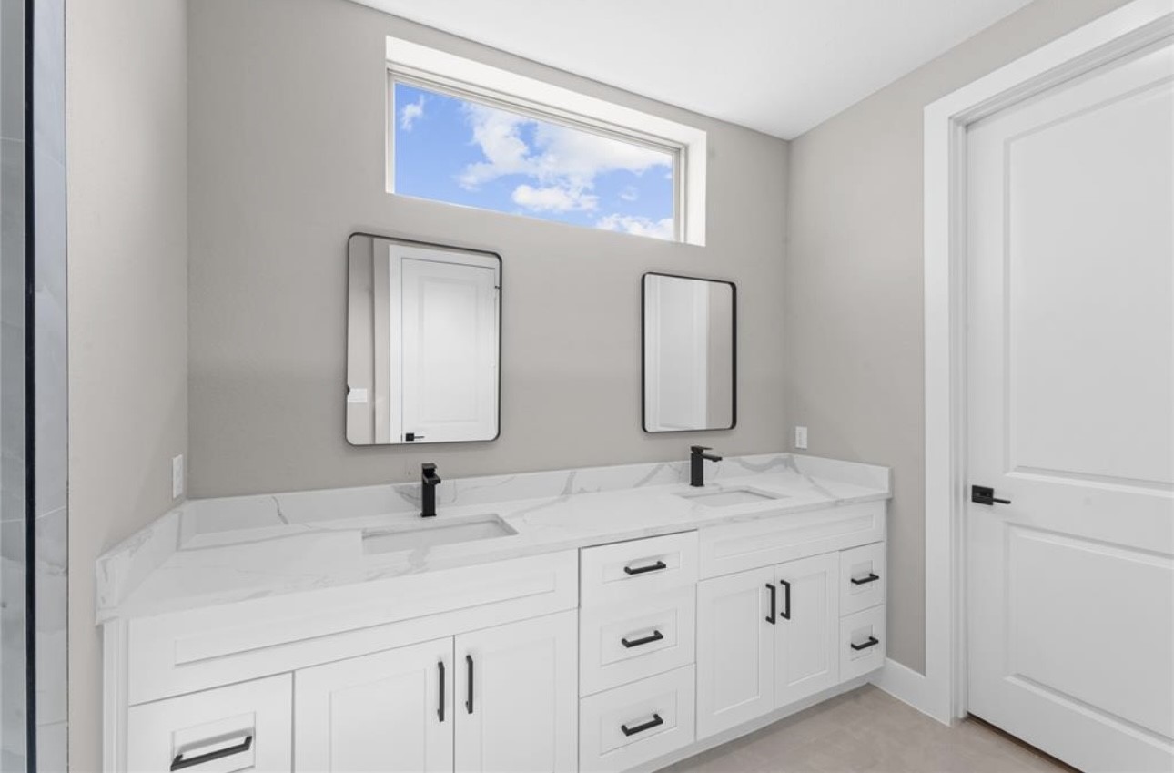 2614 Martinas Ct Spring Spring, TX 77388 - Photo 11 of 15 a bathroom with double sink and a mirror