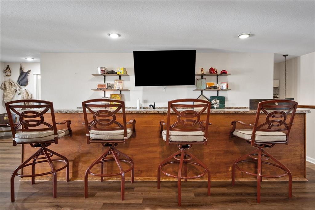 226 Palisade Loop Mabank, TX 75156 - Photo 18 of 40 a workspace with furniture and wooden floor