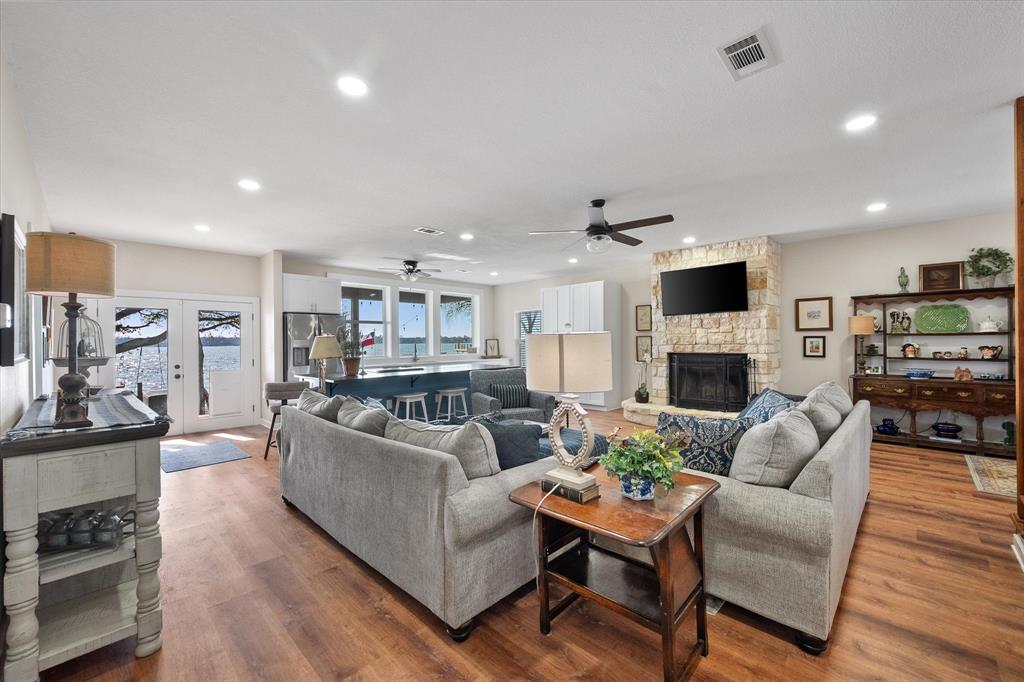 226 Palisade Loop Mabank, TX 75156 - Photo 2 of 40 a living room with furniture a fireplace and a flat screen tv
