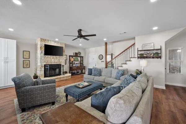 a living room with furniture fireplace and a flat screen tv