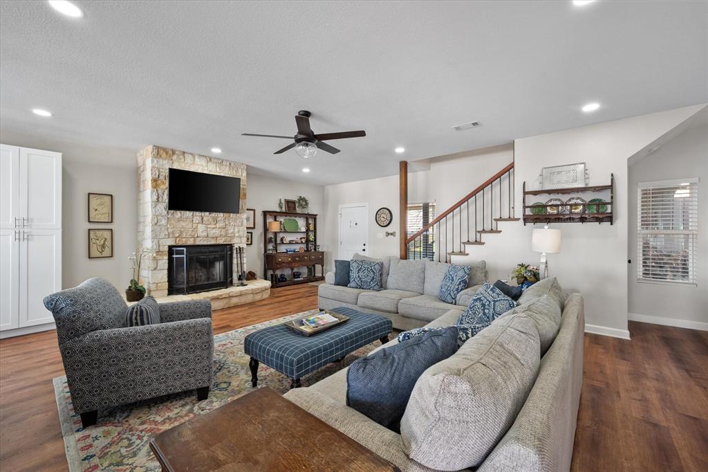 226 Palisade Loop Mabank, TX 75156 - Photo 3 of 40 a living room with furniture fireplace and a flat screen tv