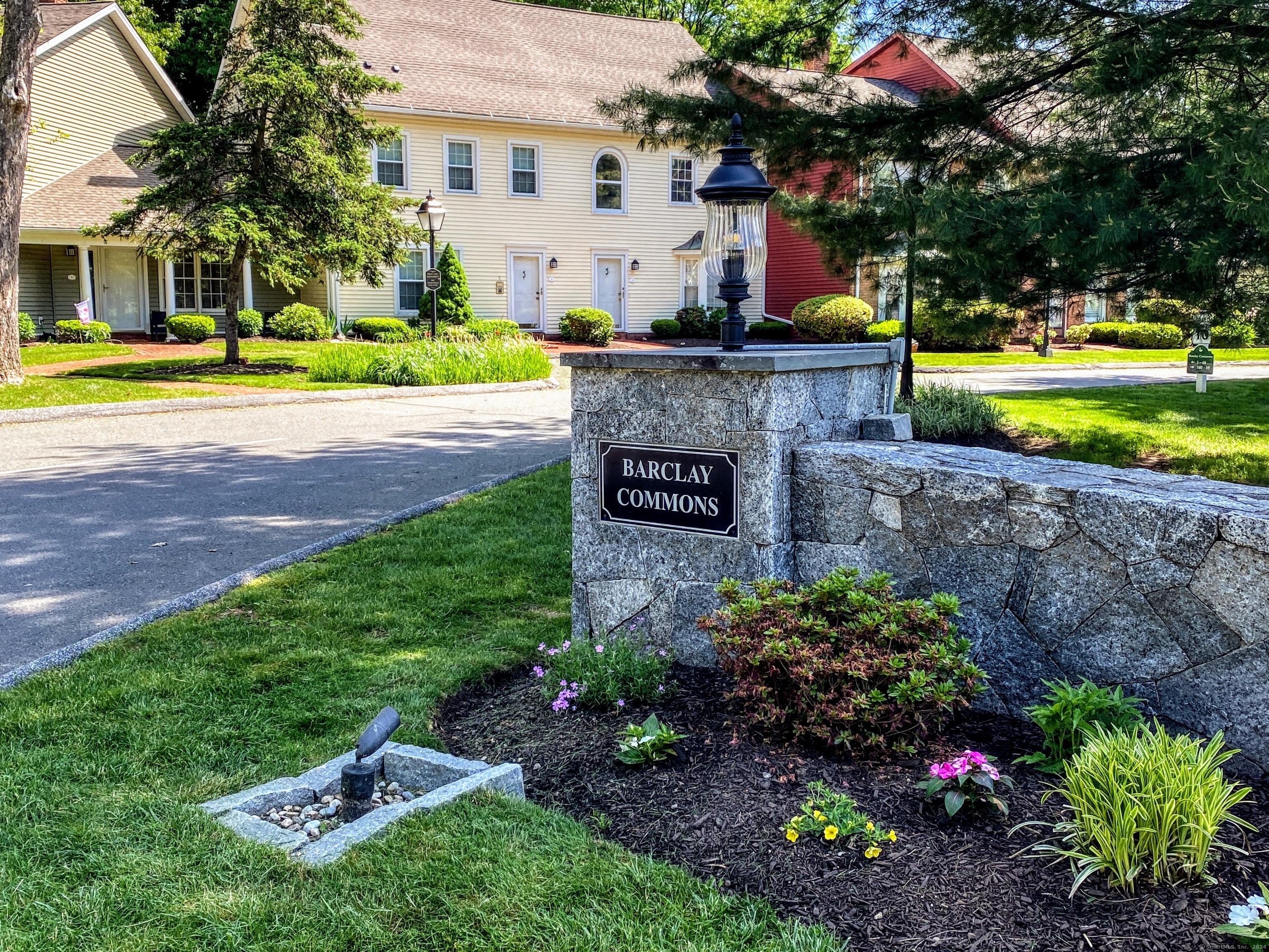 1 East Hayestown Road, Unit 15 Danbury, CT 06811 - Photo 1 of 1 a front view of a house with a yard and a garden