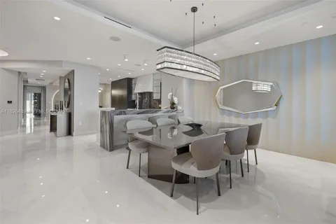 a kitchen with stainless steel appliances granite countertop a stove and a refrigerator