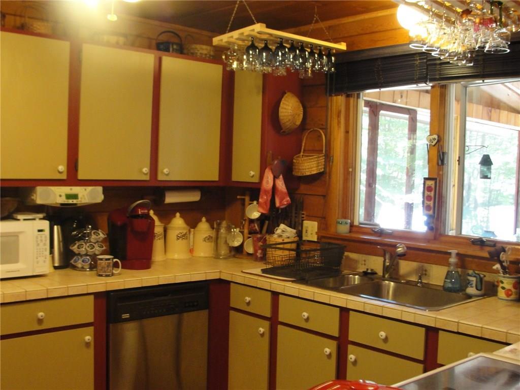 12 Chickadee Road Bridgton, ME 04009 - Photo 12 of 35 Kitchen cabinets are painted with a...