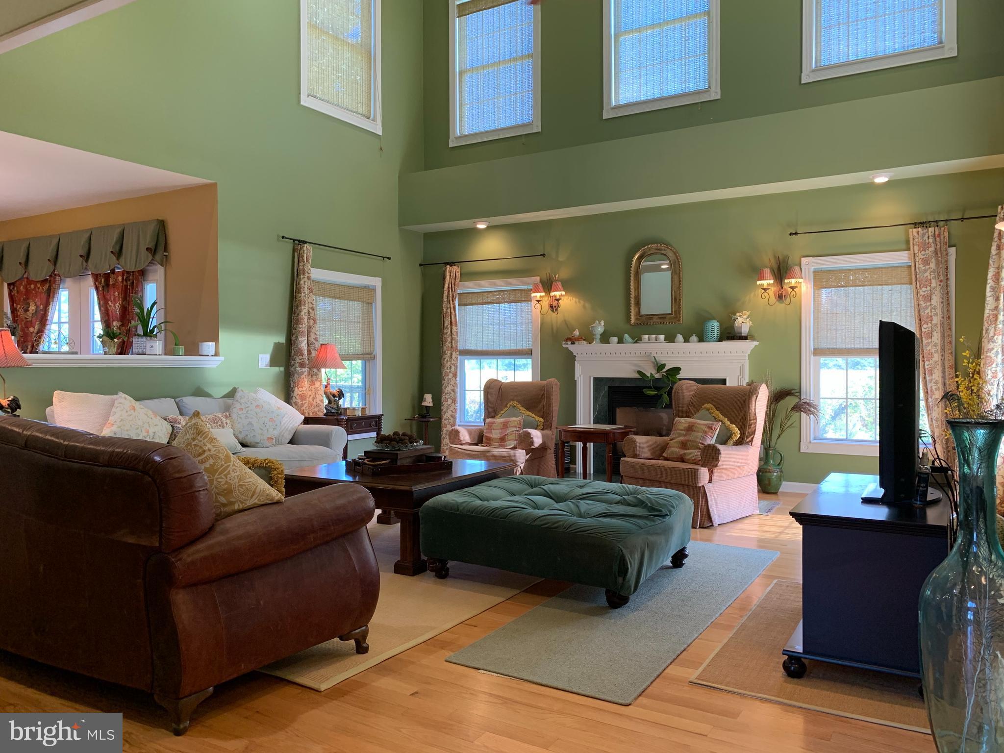 163 Sharon Station Road Robbinsville, NJ 08691 - Photo 13 of 38 a living room with furniture and a fireplace