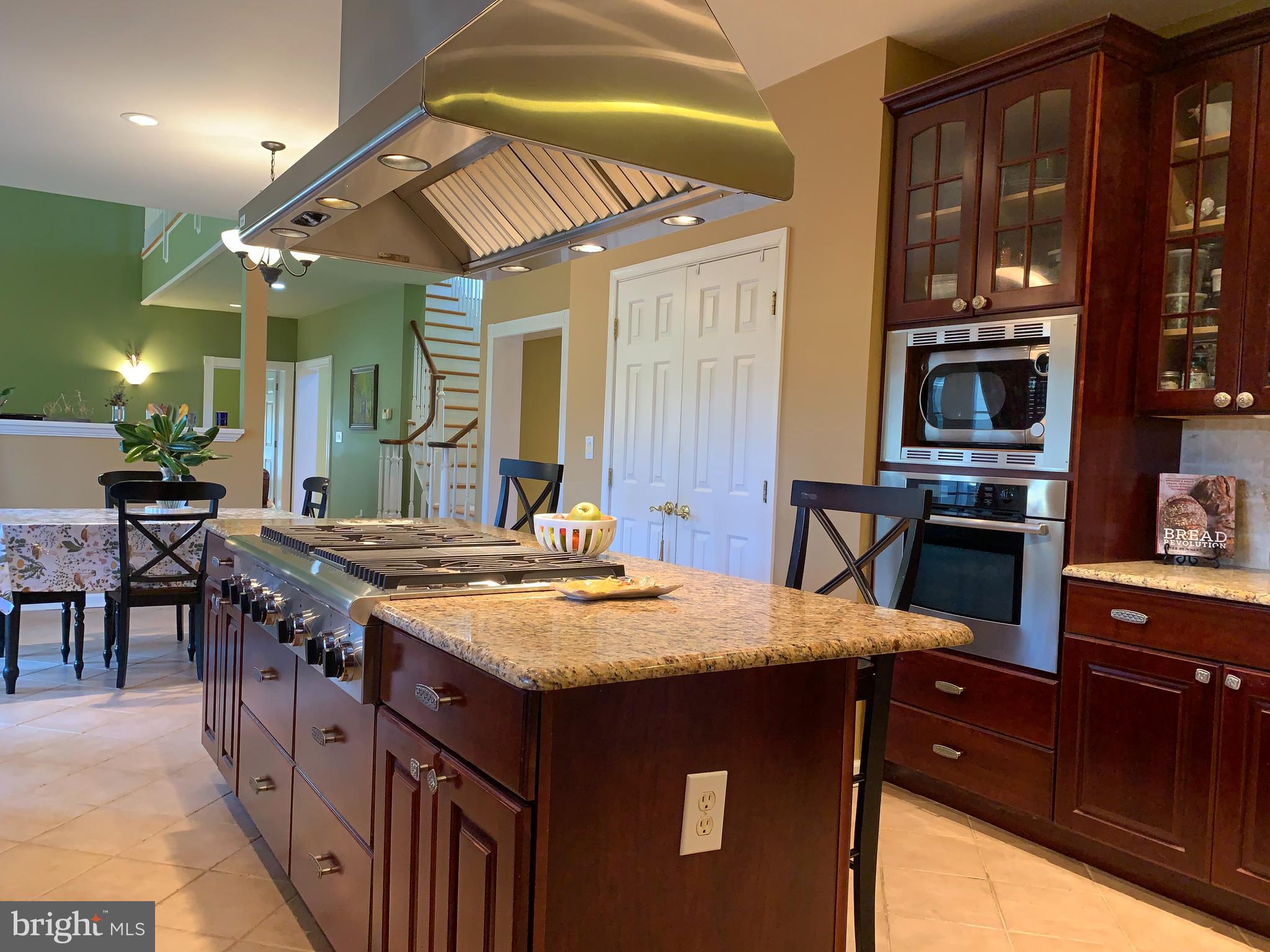 163 Sharon Station Road Robbinsville, NJ 08691 - Photo 19 of 38 a kitchen with stainless steel appliances granite countertop a stove a sink and a refrigerator
