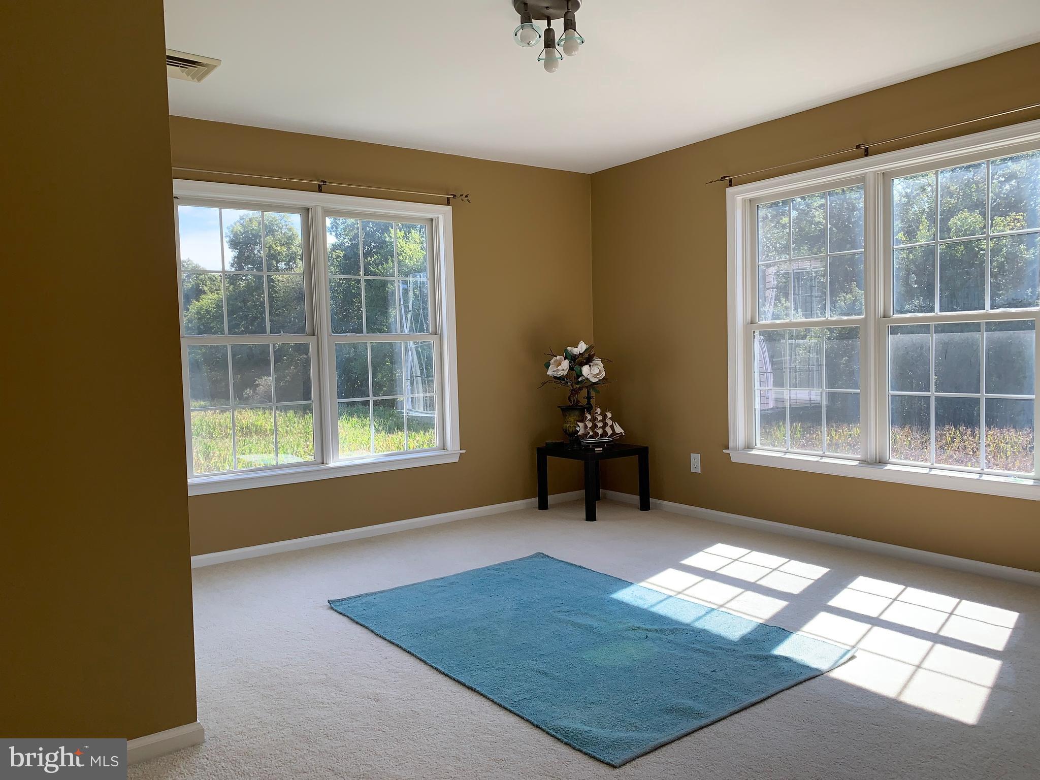 163 Sharon Station Road Robbinsville, NJ 08691 - Photo 26 of 38 a living room with furniture and a window