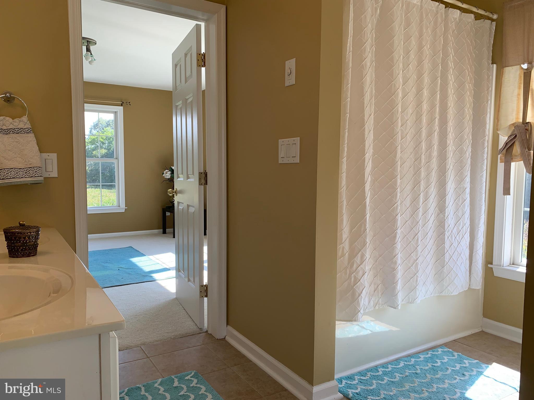163 Sharon Station Road Robbinsville, NJ 08691 - Photo 30 of 38 a view of a bedroom bathroom and front door