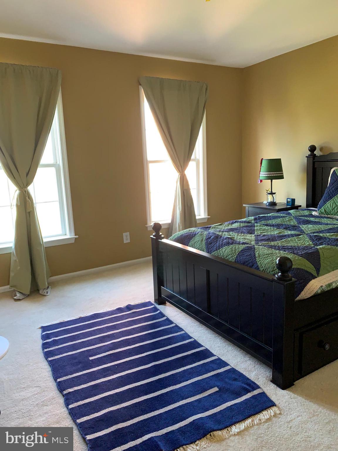 163 Sharon Station Road Robbinsville, NJ 08691 - Photo 33 of 38 a bedroom with a bed and window