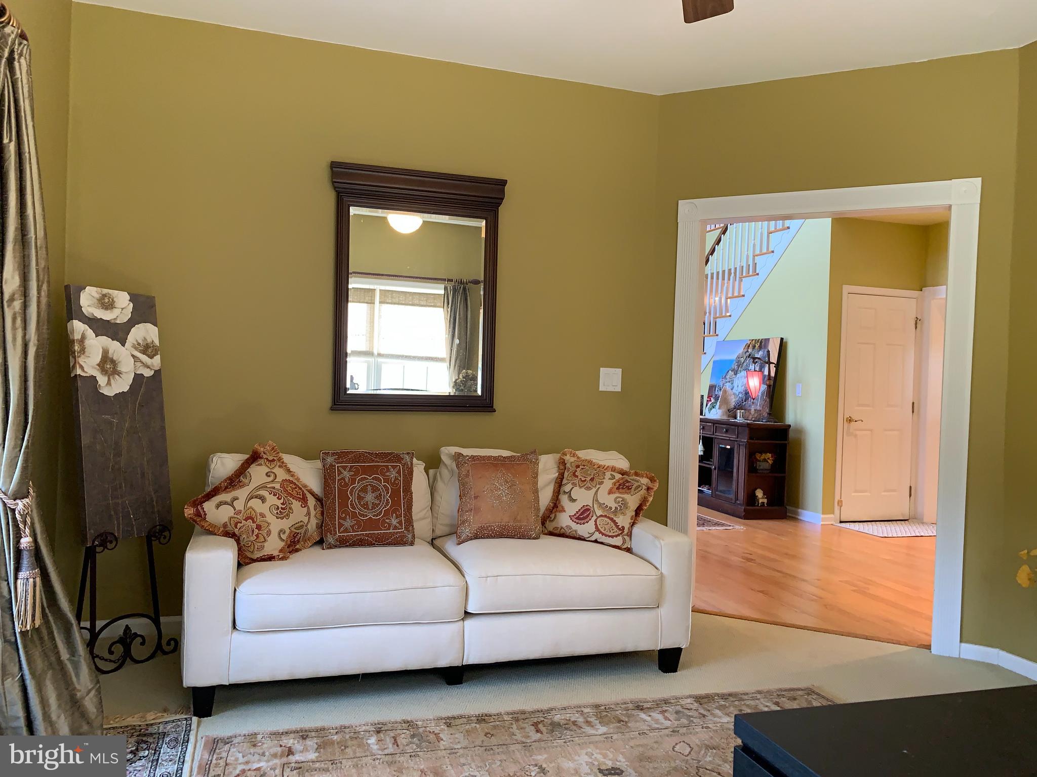 163 Sharon Station Road Robbinsville, NJ 08691 - Photo 6 of 38 a living room with furniture and wooden floor