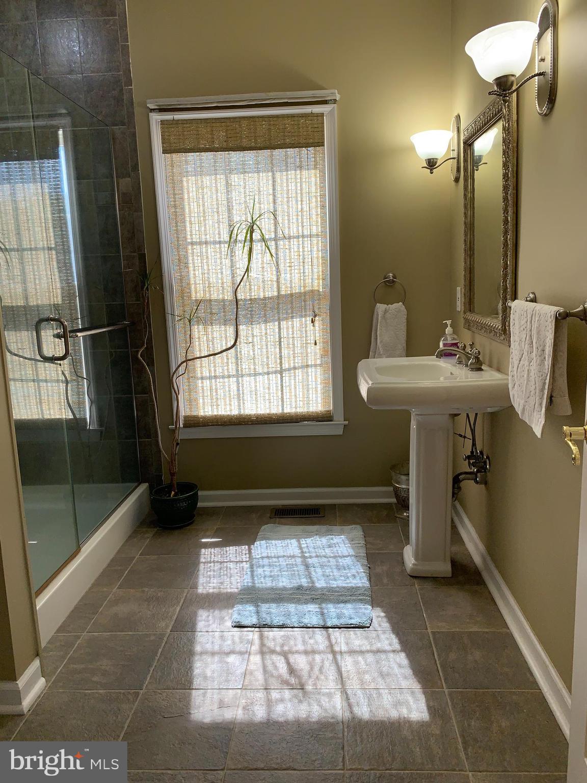 163 Sharon Station Road Robbinsville, NJ 08691 - Photo 10 of 38 a bathroom with a sink toilet and shower