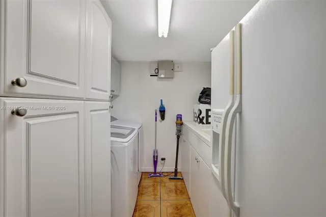 a view of hallway with washer and dryer