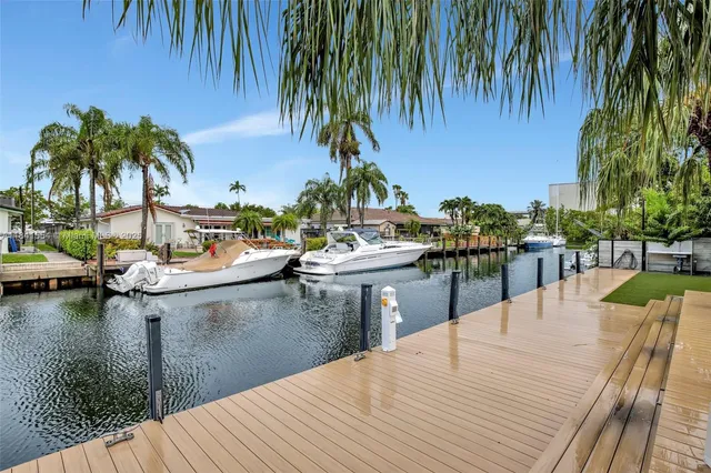 a view of a lake with couches chairs