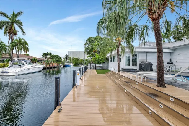 a view of a swimming pool with a table and chairs