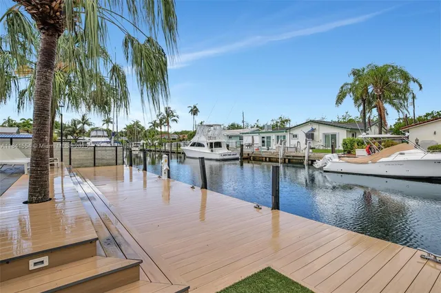 a view of a swimming pool with outdoor seating